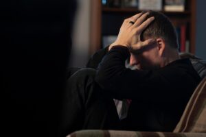 a man thinking - What is Postpartum Depression