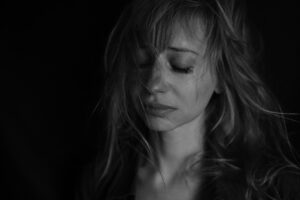 a woman crying and depressed - What Is Manic Depression
